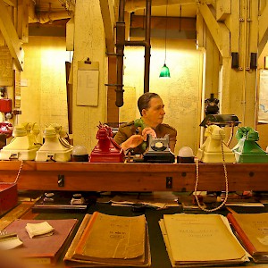 A mannequin mans the bank of phones in the Cabinet War Rooms
				(Photo Â© by Reid Bramblett)