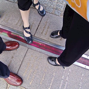 The popular tradition of standing in two hemispheres along the official Prime Meridian (Longitude 0Âº) at the Royal Observatory in Greenwich (Photo Â© Reid Bramblett)