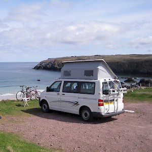 A camper and a tent overlooking a killer whale migration route at Sango Sands Campsite, Durness, Sutherland, Scotland (Photo by John Allen)