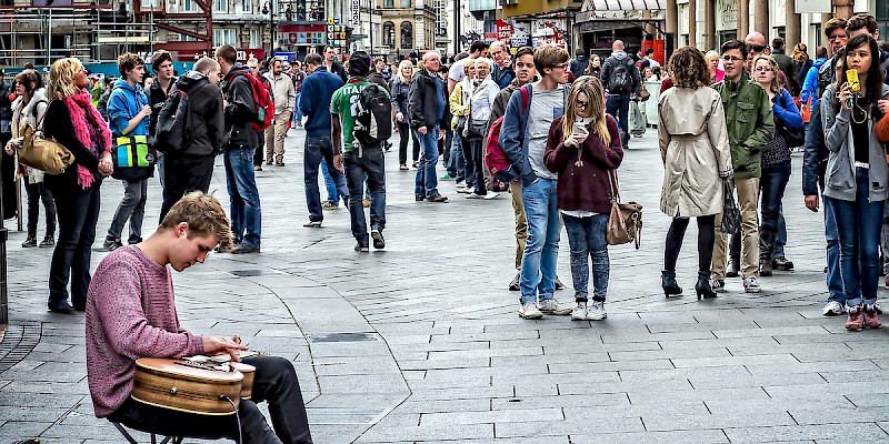 A lone busker entertains the passing crowds in Leicester Square (Photo by Garry Knight)