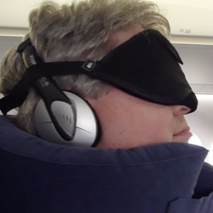 The author wearing his sleeping-on-the-plane gear (Photo Â© Reid Bramblett)