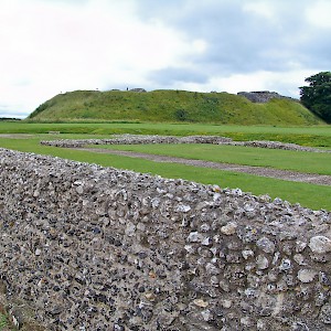 The remains of some walls, with the central hill stop which once sat the castle in the background (Photo Â© Reid Bramblett)